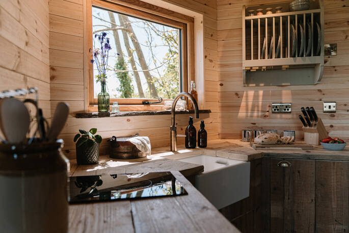 A fully equipped kitchen with artisan crockery